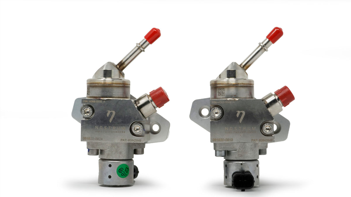 NostrumHP BMW S55 HPFP upgrade showing dual fuel pumps with red caps and metal construction